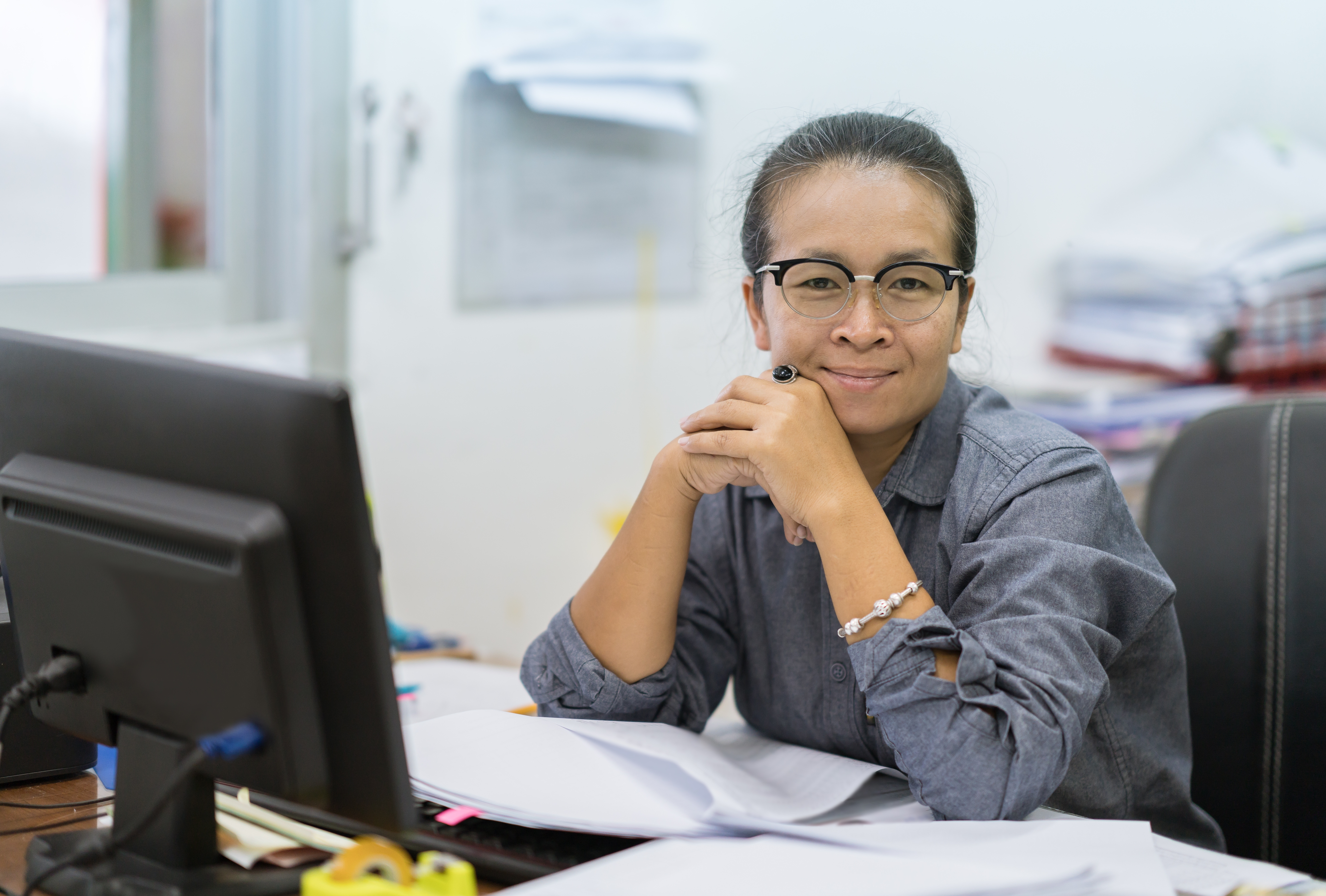 Portrait of lab Manager working at a computer.